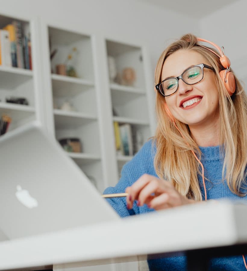 A learner smiling while studying